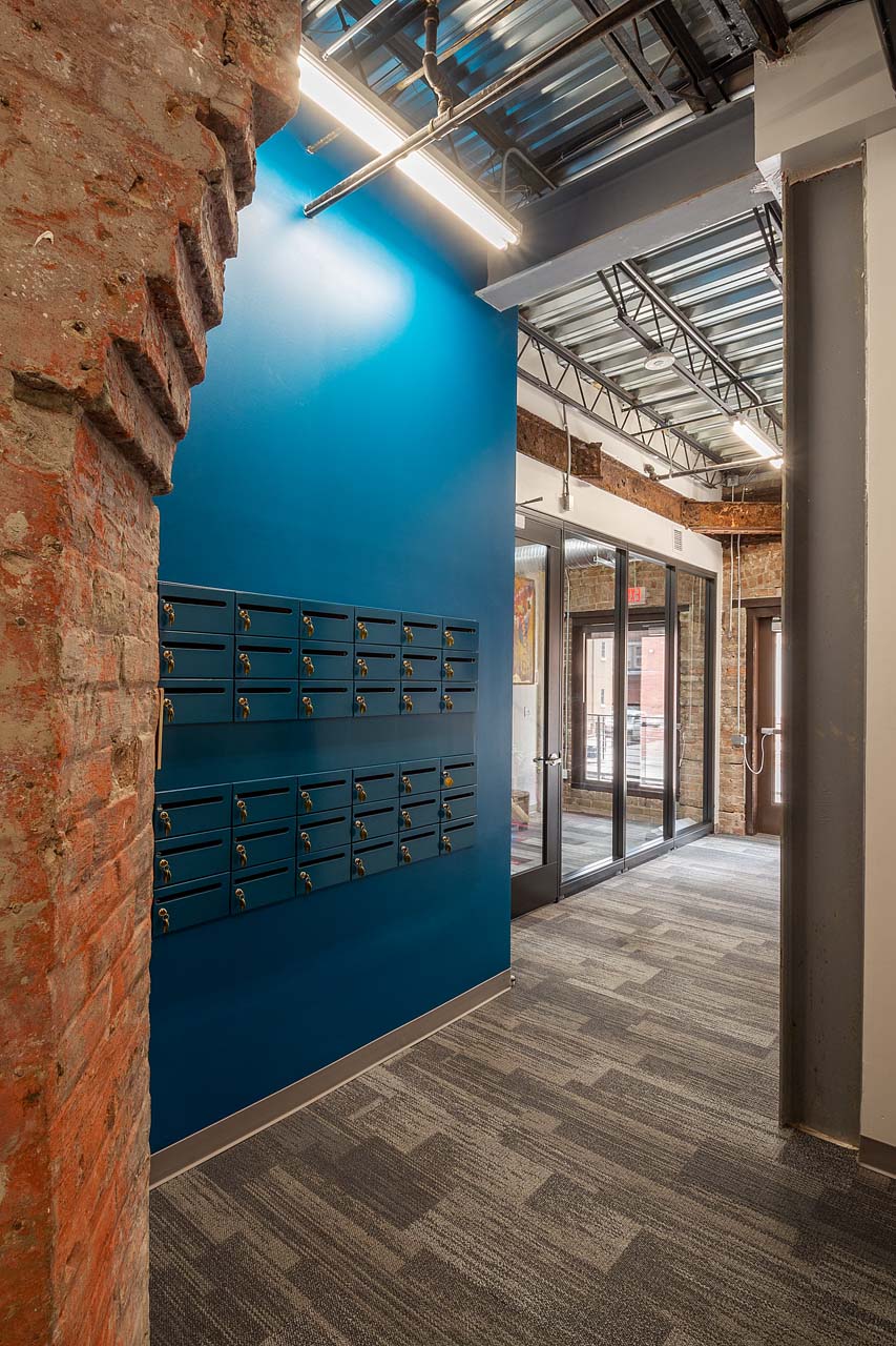 View of mailboxes for rent and reception area door.