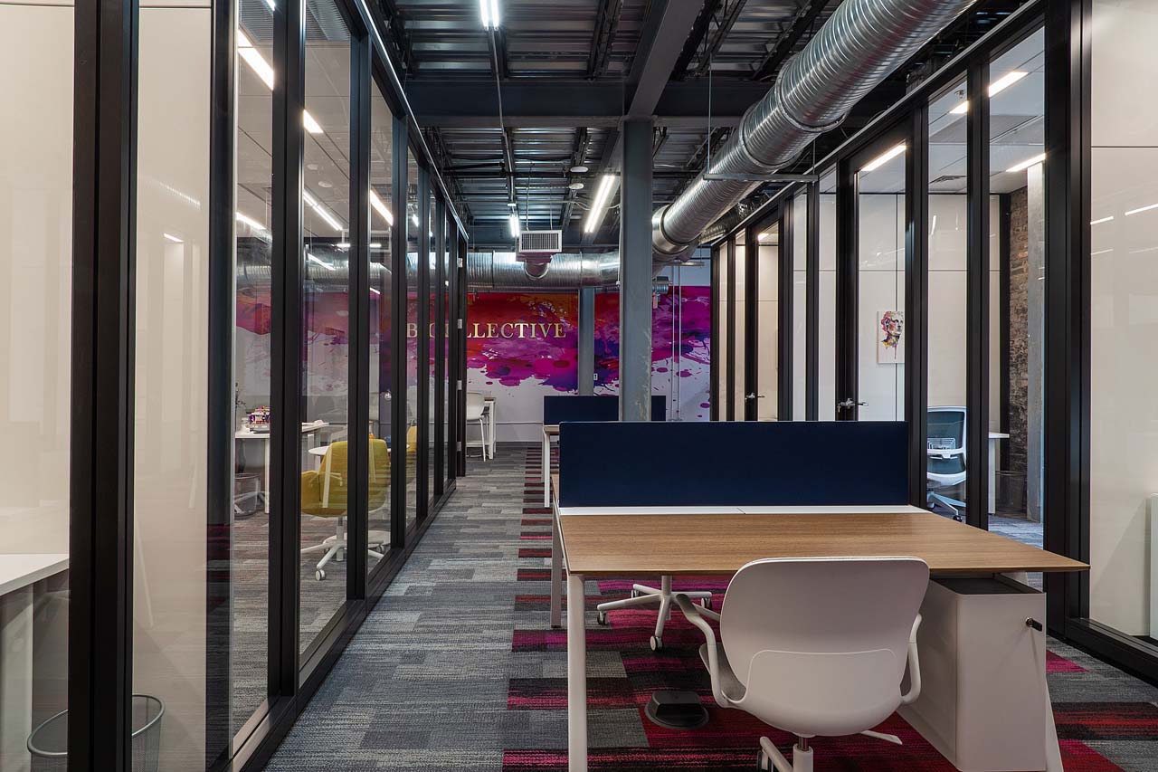 View of main corridor featuring hot desks